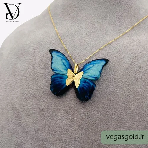 مدل پلاک پروانه طلا با بال های پارچه ای آبی و مشکی